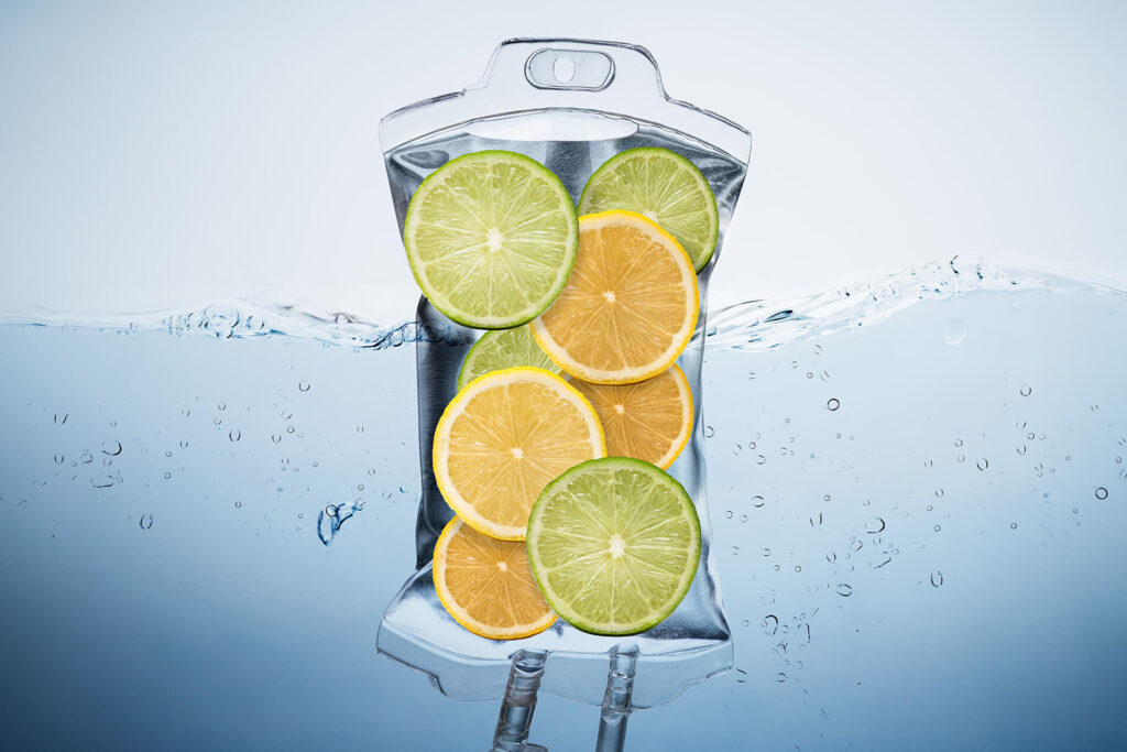 A bag of Citrus IV with actual citrus fruit representing the vitamins that would be given from this IV Nutritional Bag.