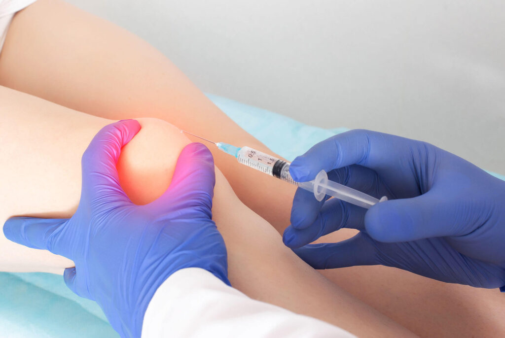 A person getting a joint injection for pain management.